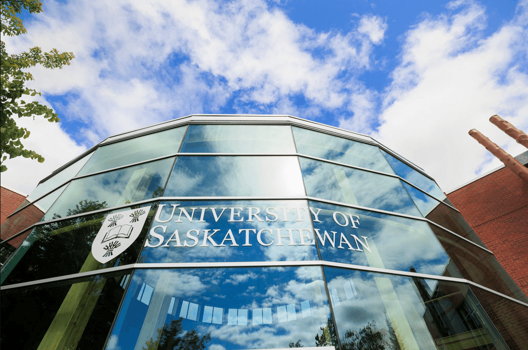 Image of a glass building featuring the University of Saskatchewan logo.