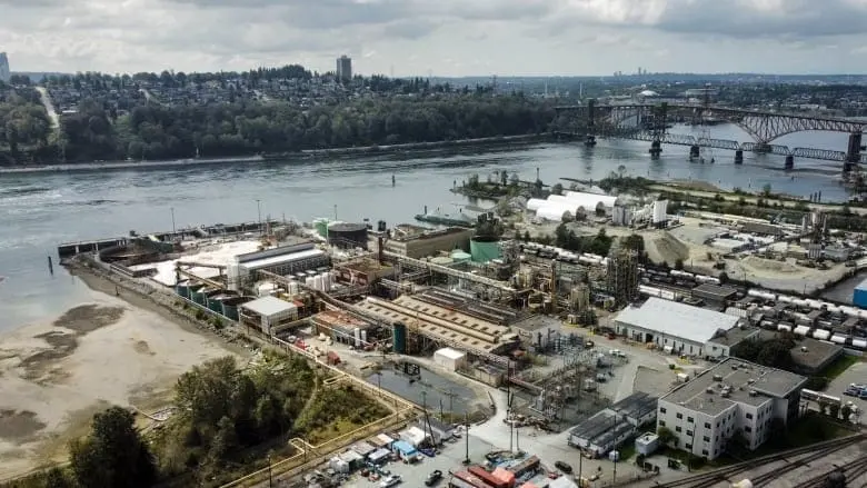 An aerial photo shows a large industrial plane on the waterfront in North Vancouver.
